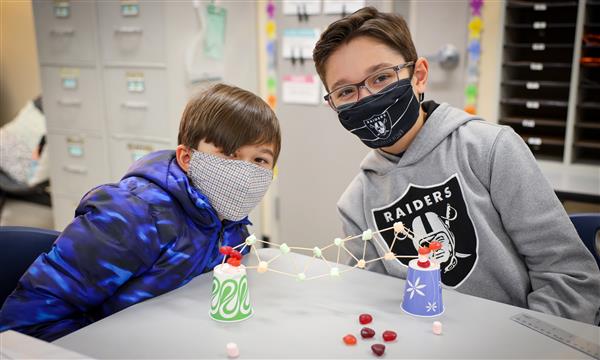 students work to build a bridge